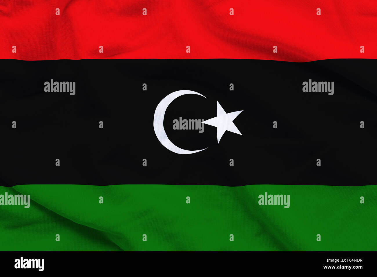 Wavy and rippled national flag of Libya background Stock Photo - Alamy