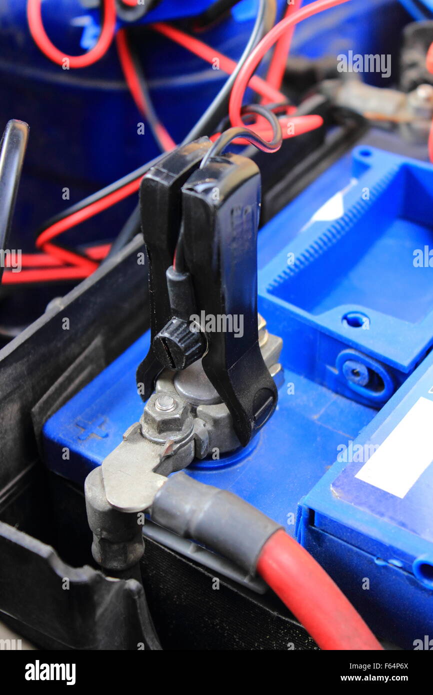 Charger with cables uses to charge old dead car battery Stock Photo Alamy