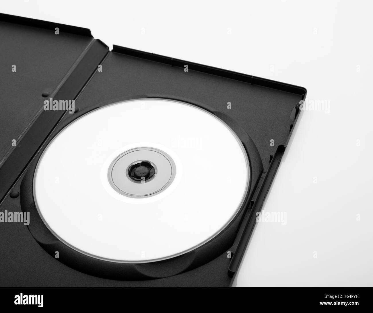 opened dvd box with empty disc over white background Stock Photo