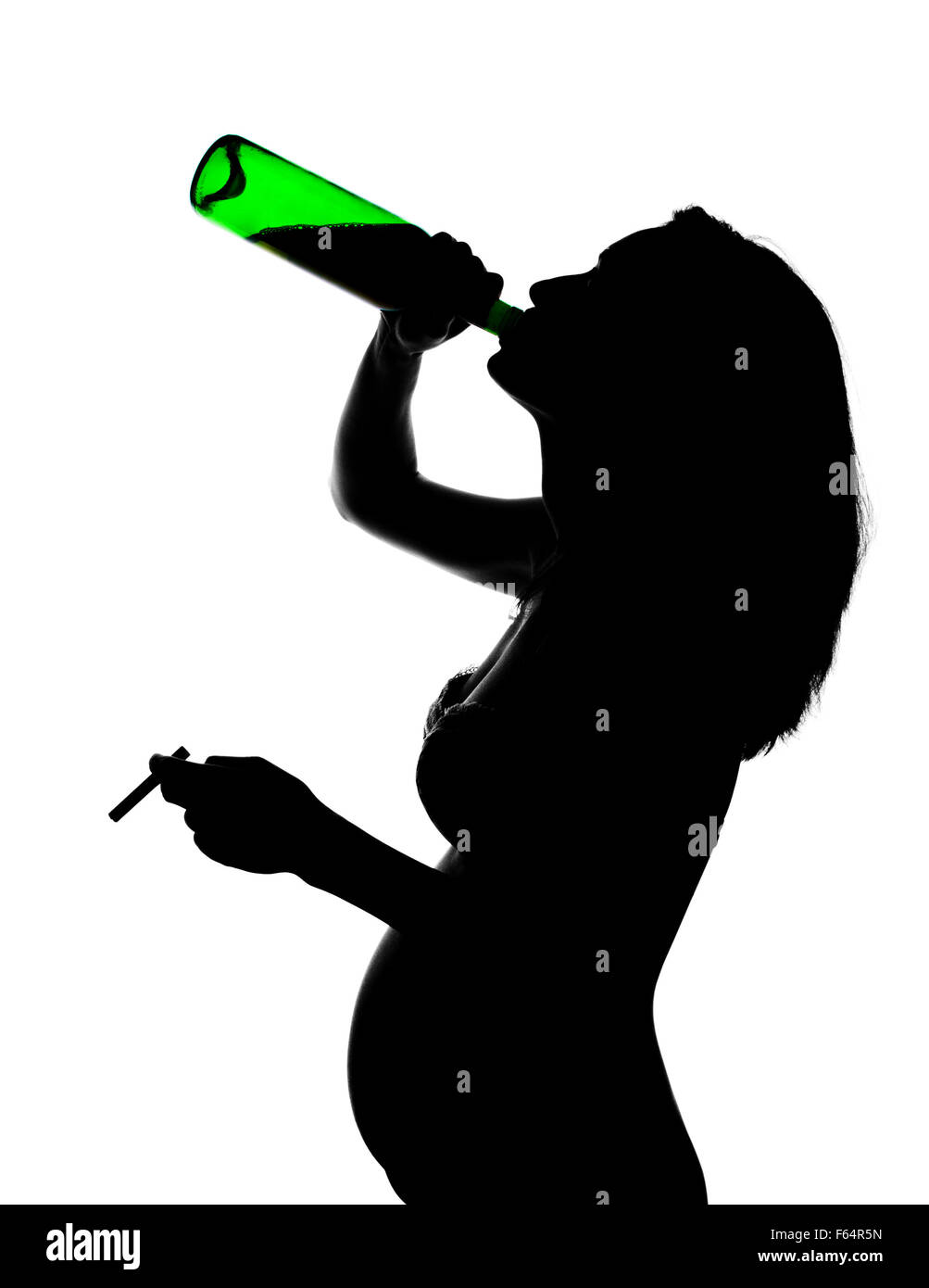 Silhouette of careless pregnant woman with alcohol and cigarette Stock Photo