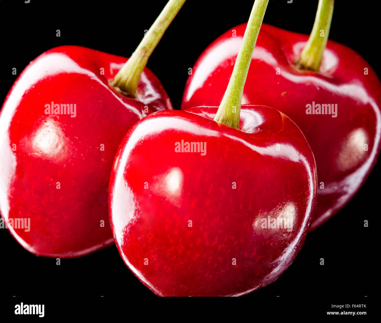 Cluster of three red ripe sweet berries Stock Photo Alamy