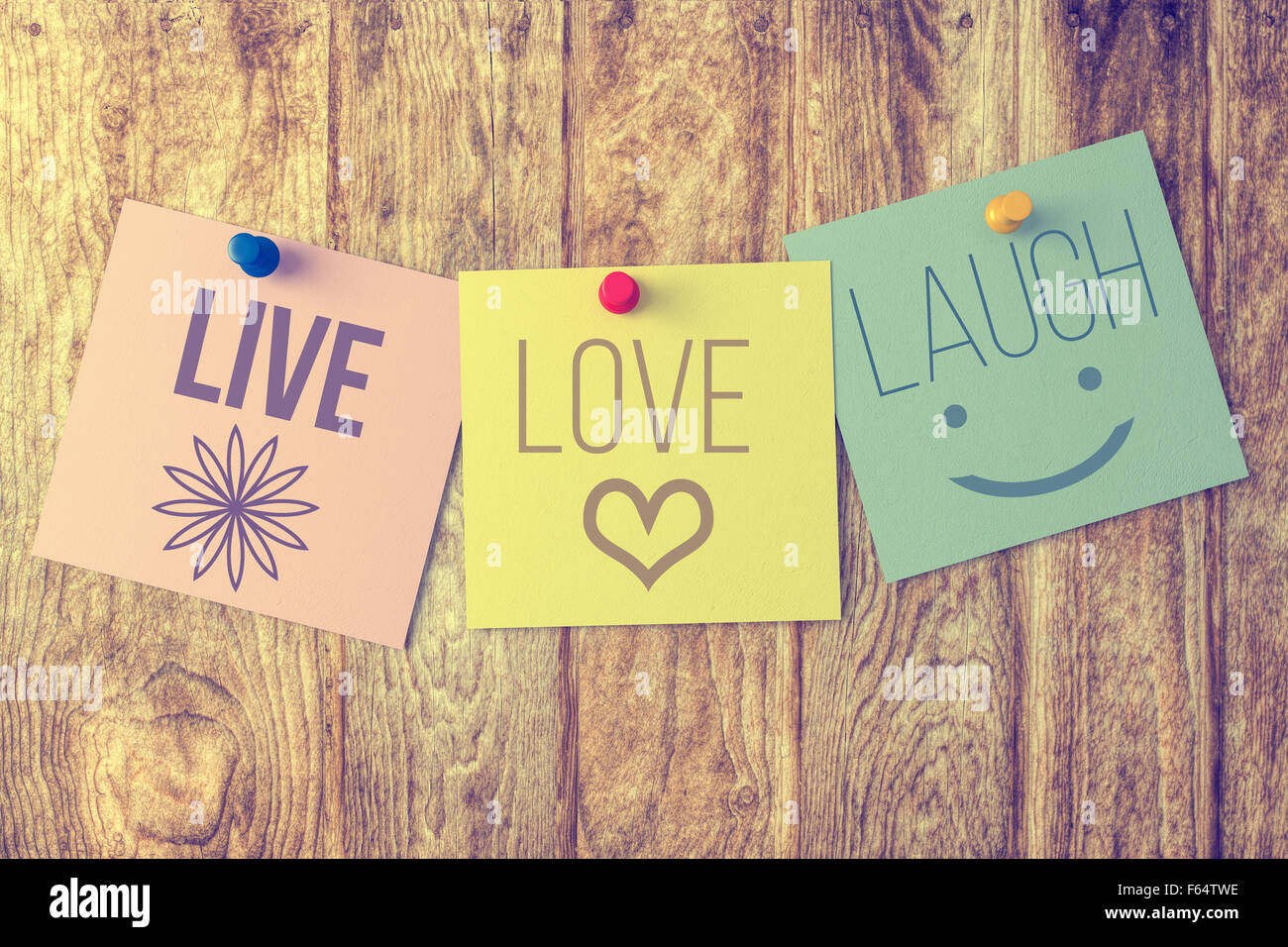 Live laugh love on wooden background Stock Photo