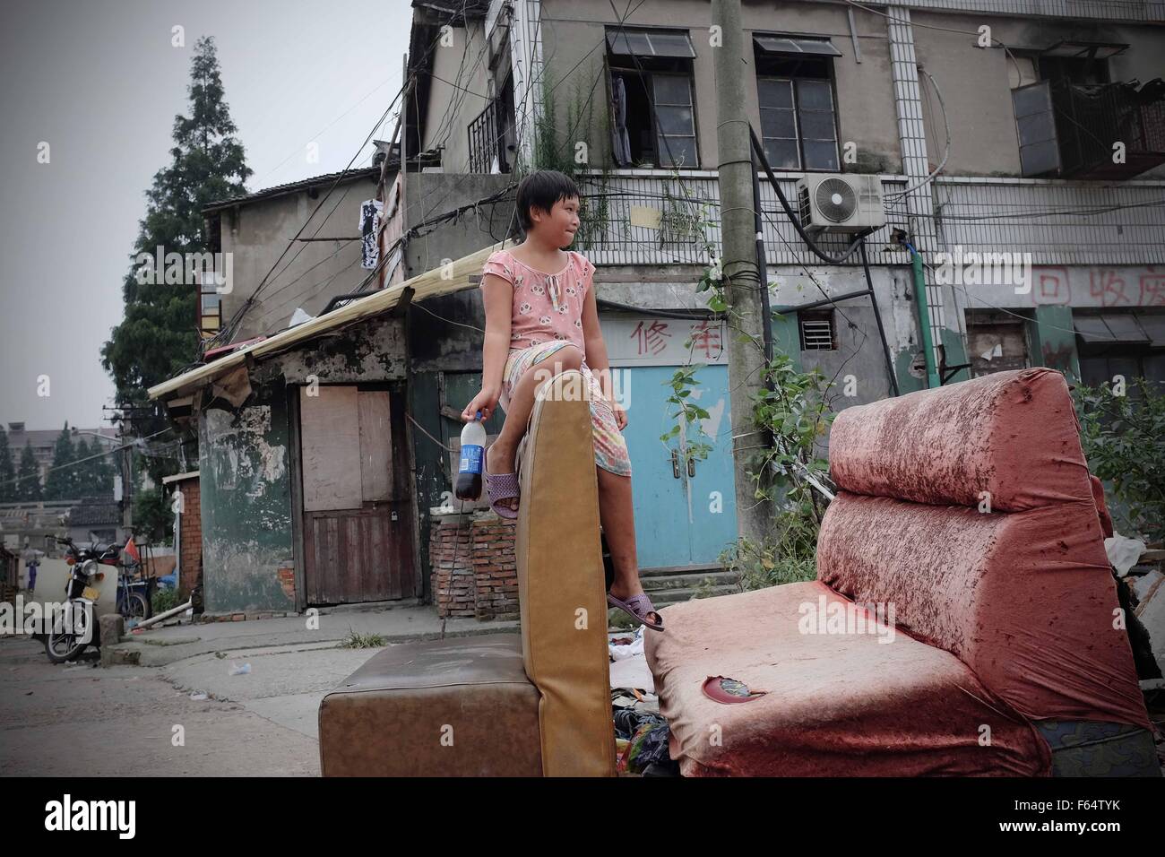 Shanghai, Shanghai, CHN. 24th Aug, 2014. Shanghai, CHINA - August 25 2014: (EDITORIAL USE ONLY. CHINA OUT) Liu Jing's parents live on collecting garbage in Shanghai. And every summer she goes to Shanghai from Yancheng Jiangsu to reunion with them as a migrant bird. © SIPA Asia/ZUMA Wire/Alamy Live News Stock Photo