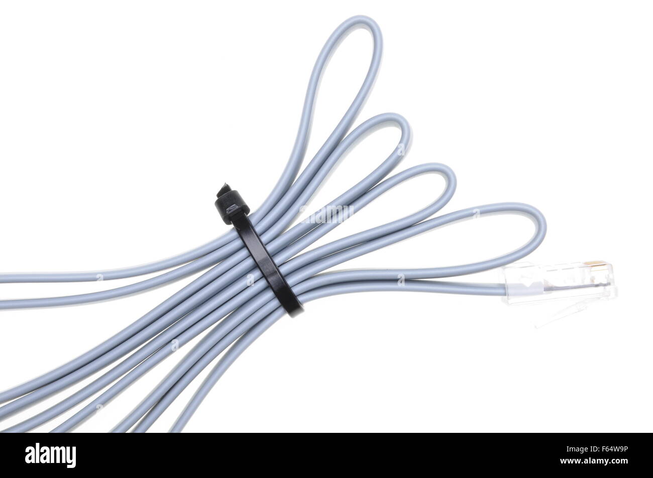 Patch cord with RJ45 plugs and cable ties isolated over white