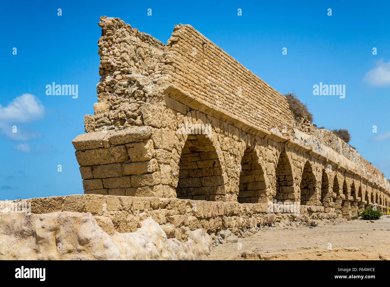 The remains of a Roman aqueduct near the historical city of Caesarea, Israel, Middle East. Stock Photo