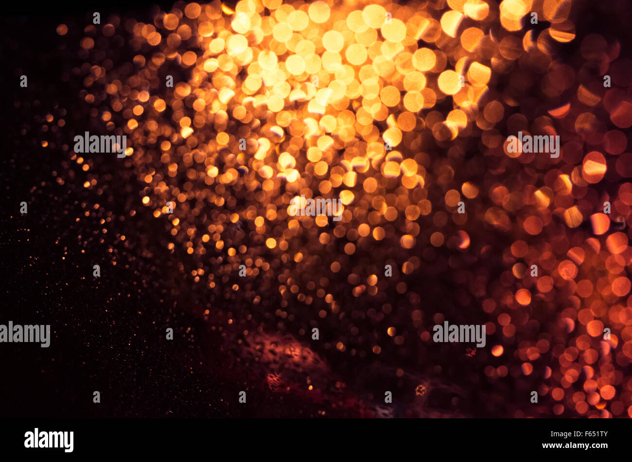 Defocused abstract golden lights background. Natural bokeh photo patten Stock Photo