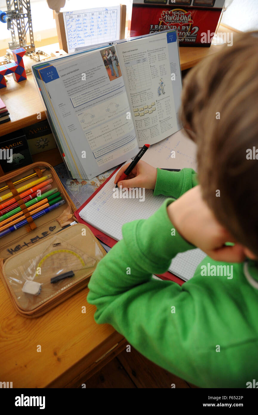 A boy is doing his homework in Dresden (Saxony) on 19 March 2013. Photo: Thomas Eisenhuth Stock Photo