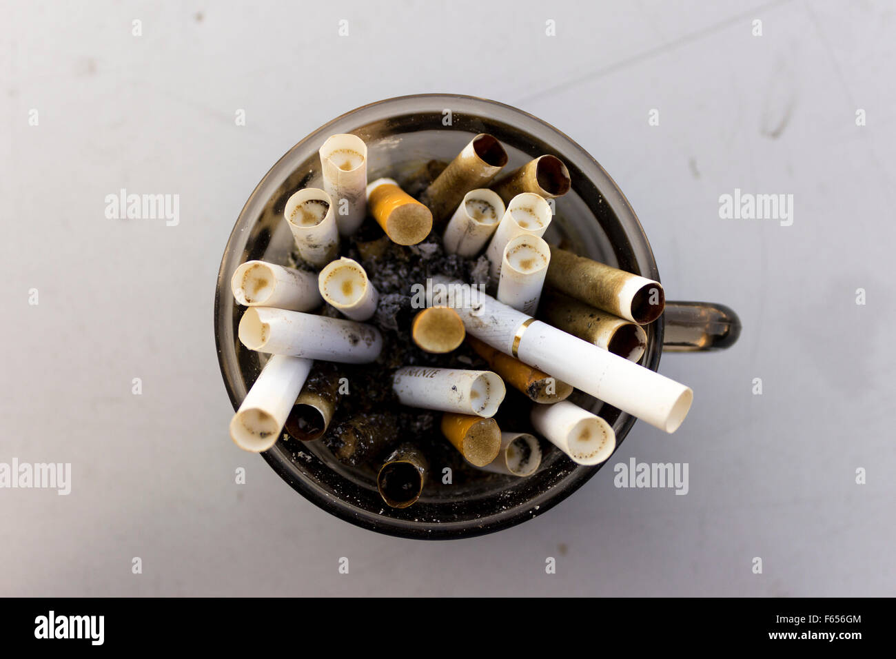 Dirty used cigarette filter hi-res stock photography and images