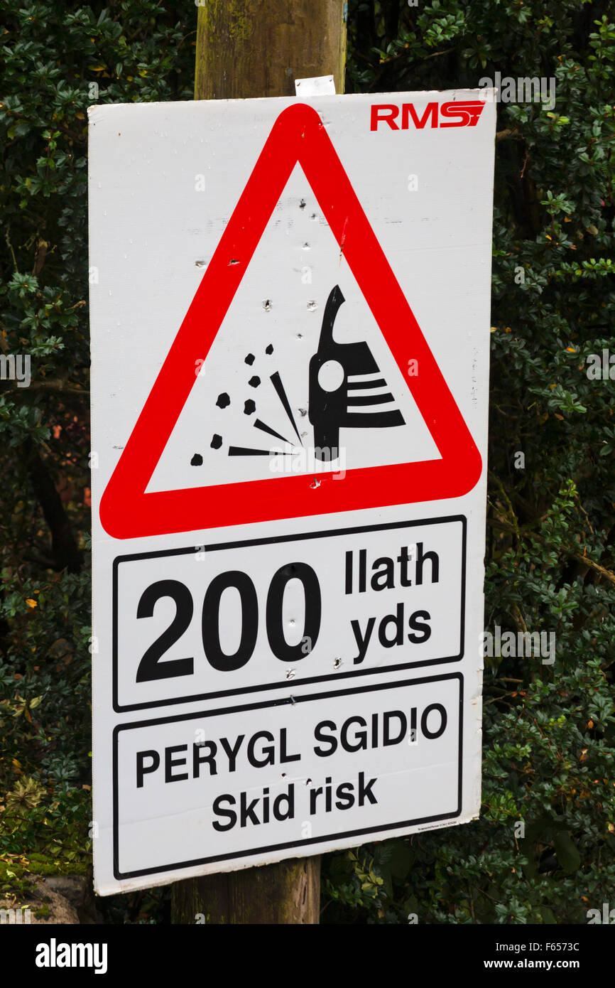 Skid risk 200 yds road sign at Cynghordy, Carmarthenshire, Mid Wales UK in November - triangular road sign triangle Stock Photo