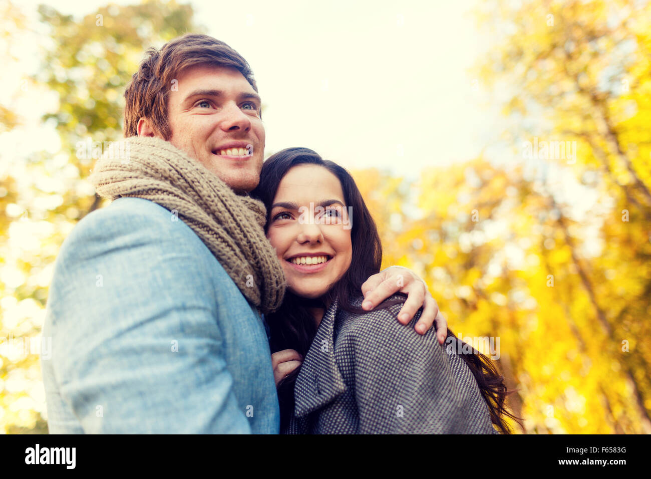 smiling couple hugging in autumn park Stock Photo - Alamy