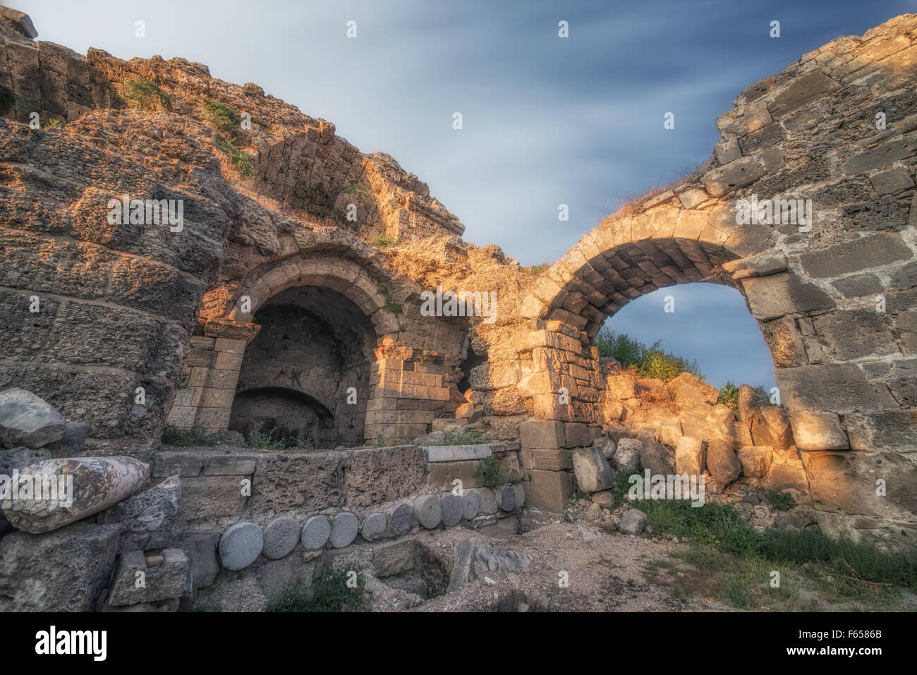 ruins in Side, Turkey at sunset - archeology background Stock Photo