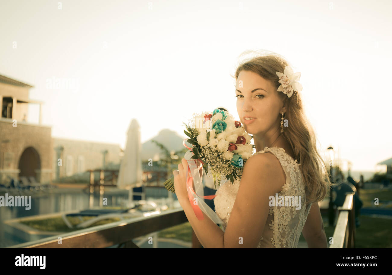 portrait of beatiful bride posing with a bouquet Stock Photo - Alamy