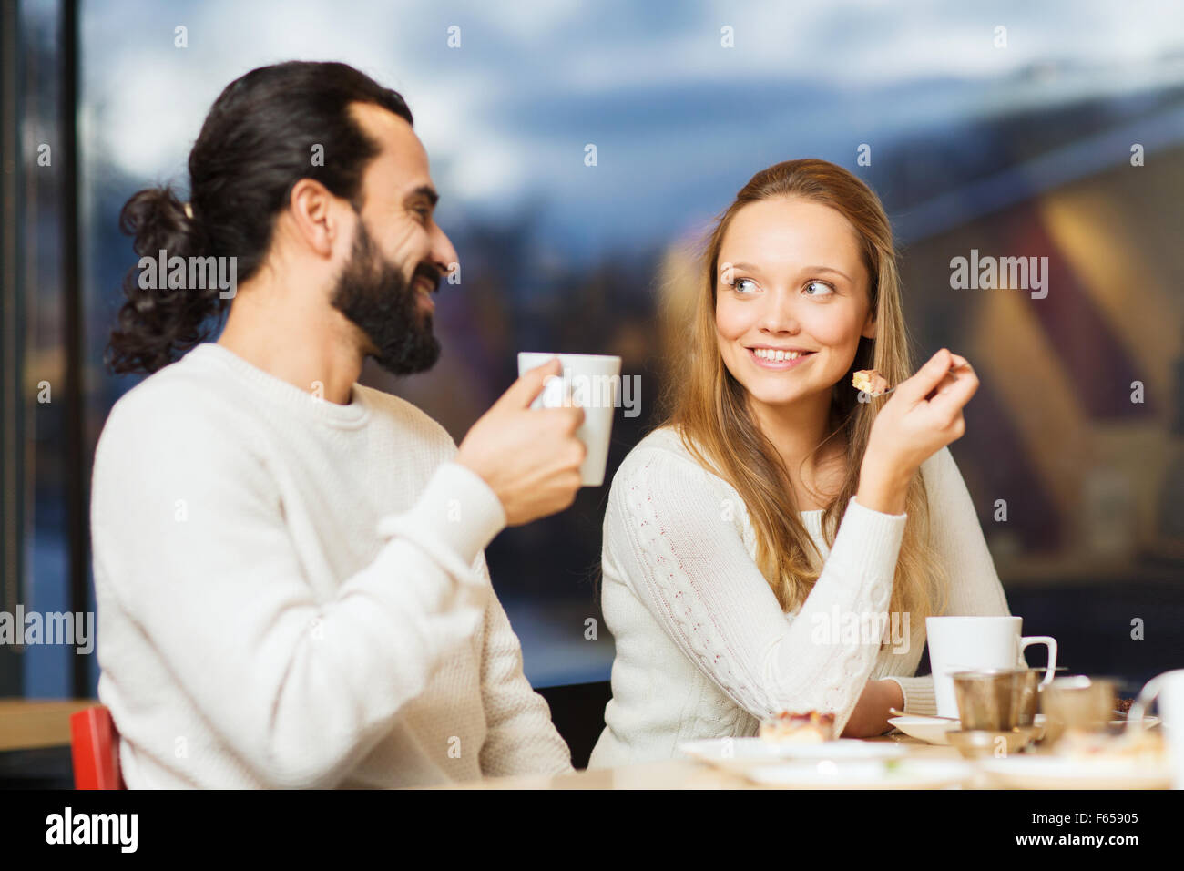 Drinking coffee girl and boy hi-res stock photography and images - Alamy