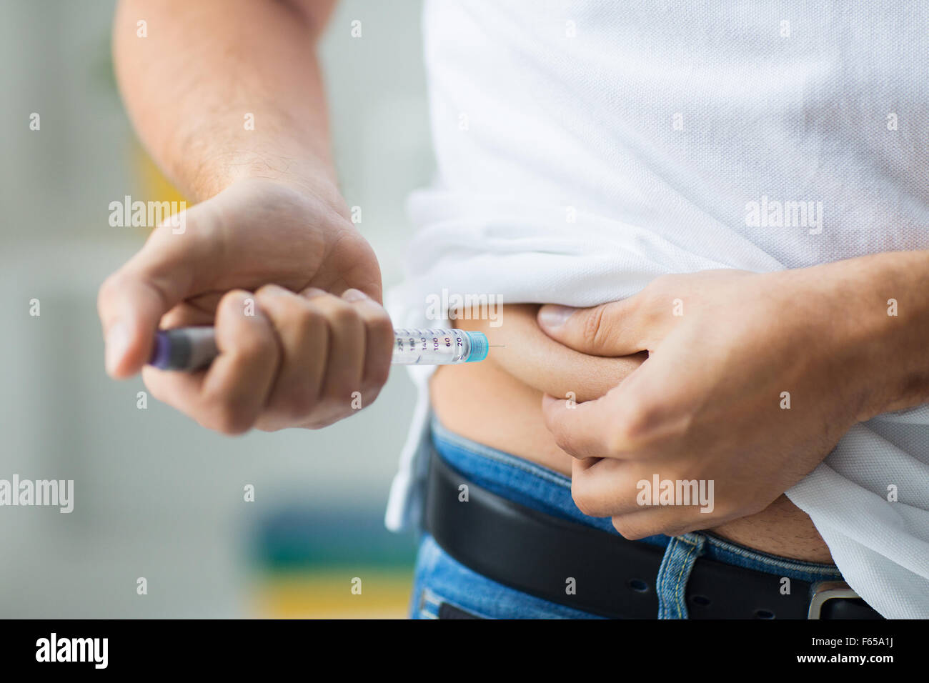 man with syringe making insulin injection Stock Photo Alamy