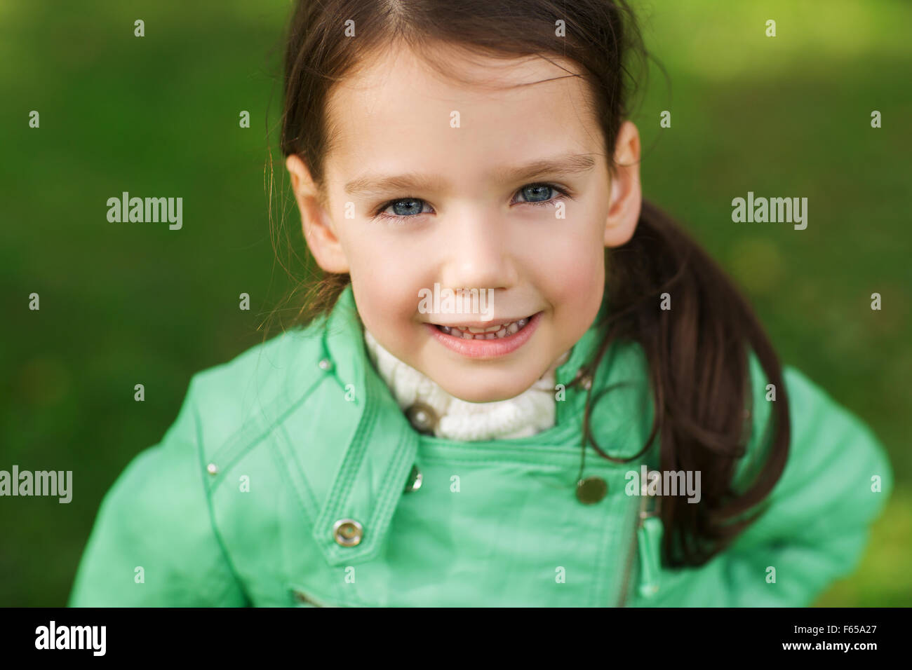 happy beautiful little girl portrait outdoors Stock Photo - Alamy