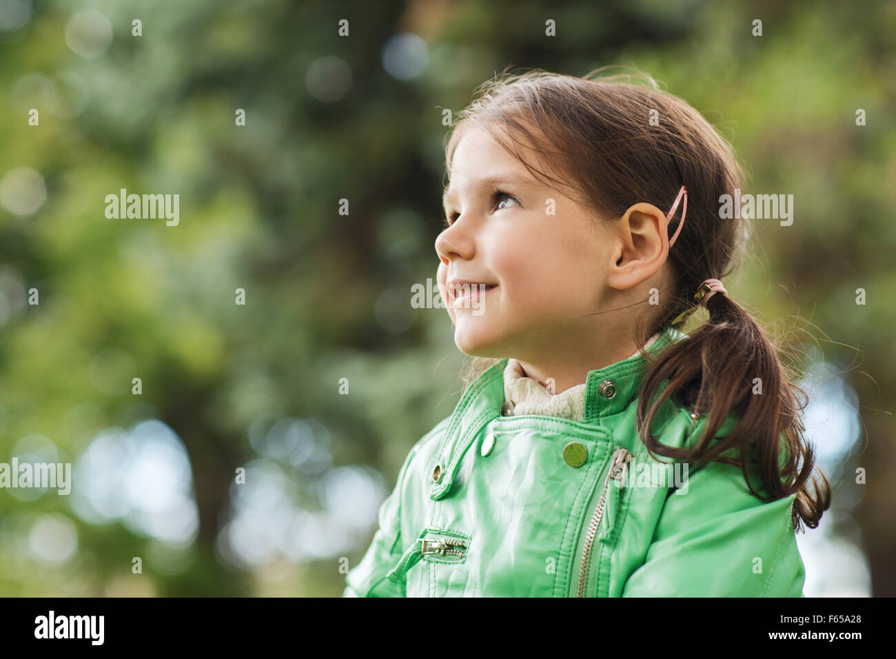 happy beautiful little girl portrait outdoors Stock Photo - Alamy