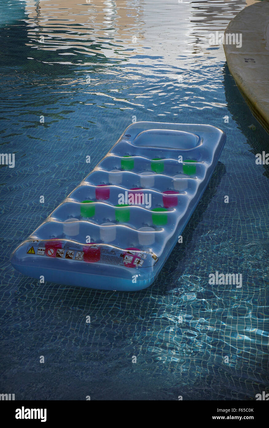 air bed floating on swimming pool Stock Photo Alamy