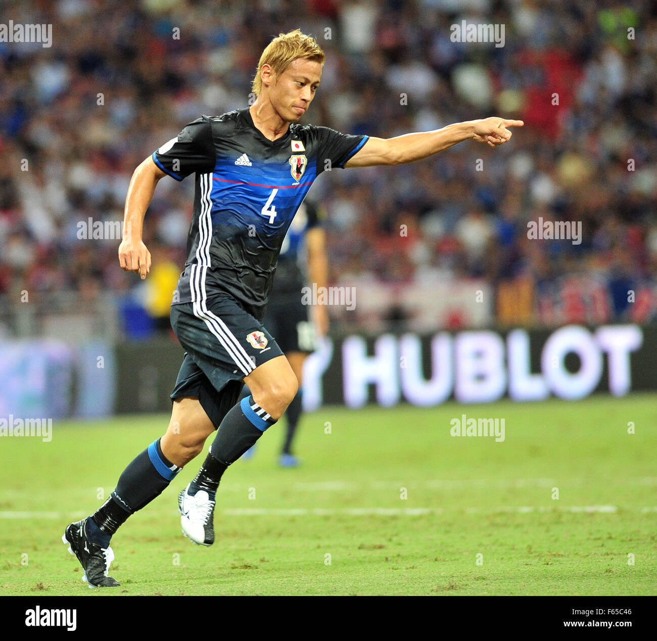 Singapore. 12th Nov, 2015. Japan's Keisuke Honda celebrates after scoring during the 2018 FIFA World Cup Group E Asia qualifier match between Singapore and Japan in Singapore's National Stadium, Nov. 12, 2015. Credit:  Then Chih Wey/Xinhua/Alamy Live News Stock Photo