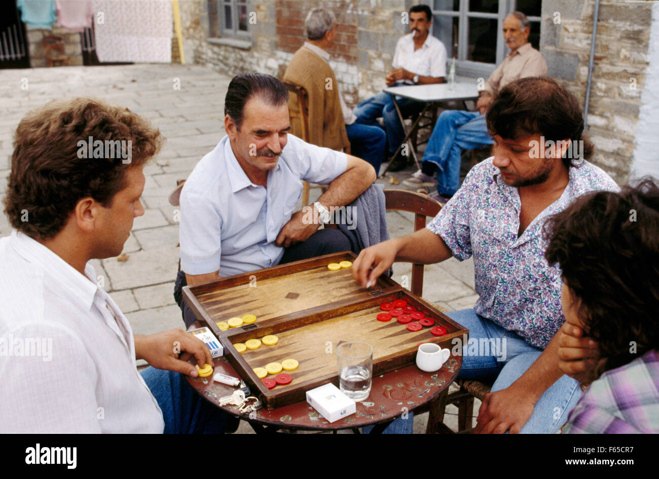 Greek men playing tavli in cafe, Pelion Stock Photo