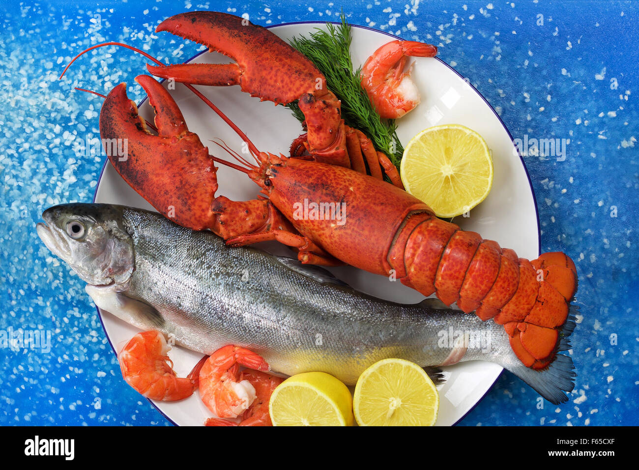 Lobster fish and prawns on chopping board Stock Photo Alamy