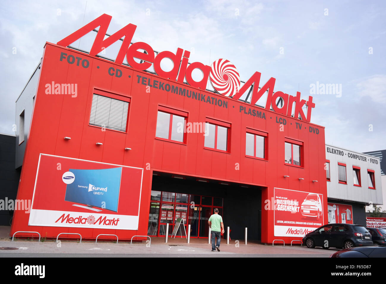 Striking red Media Markt store with logo on top in Germany Stock Photo