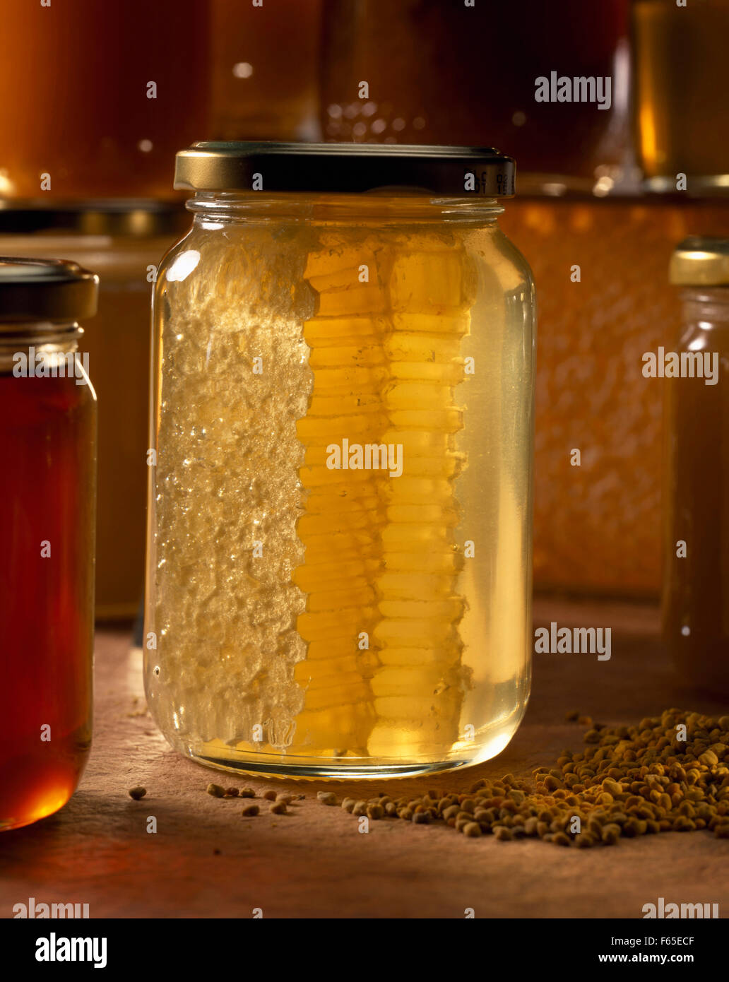jar of honey with in ray of sunlight Stock Photo Alamy