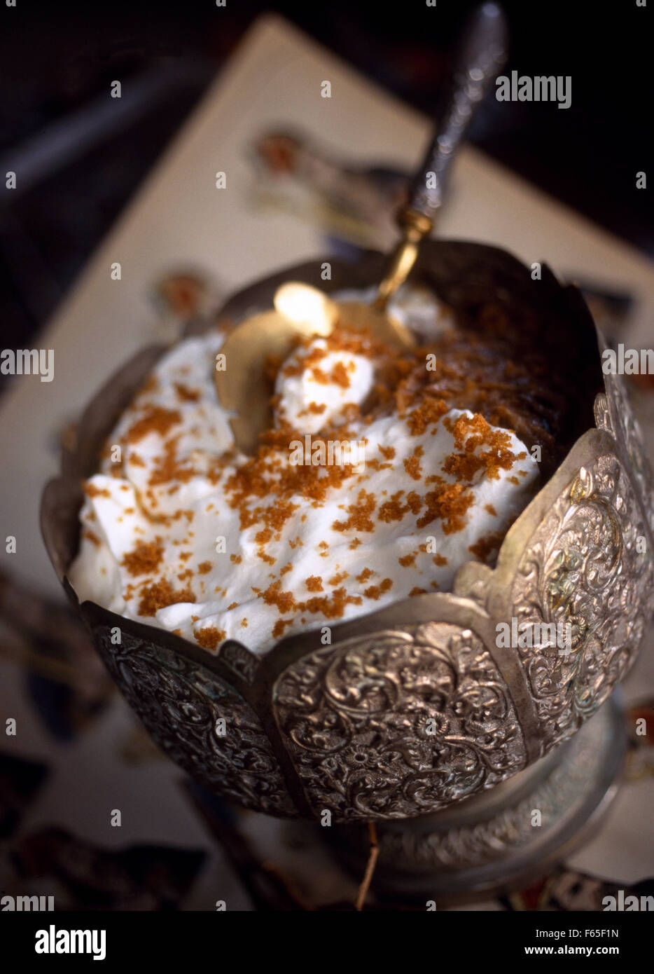 Pureed dates with cream and crumbled gingerbread Stock Photo