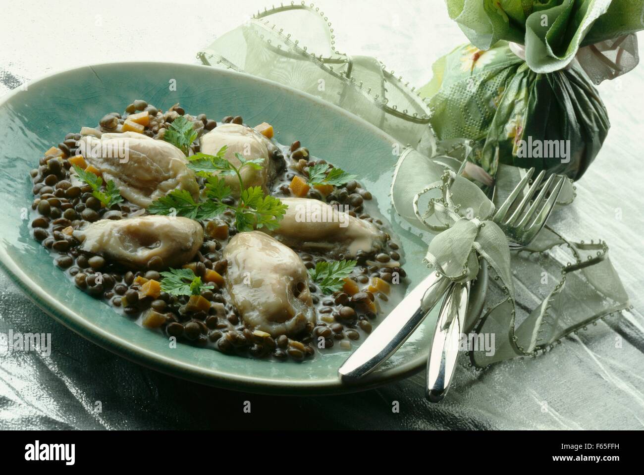 Hot oysters with creamy lentils Stock Photo