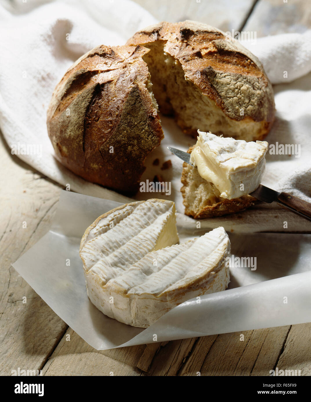 Camembert, bread and knife Stock Photo