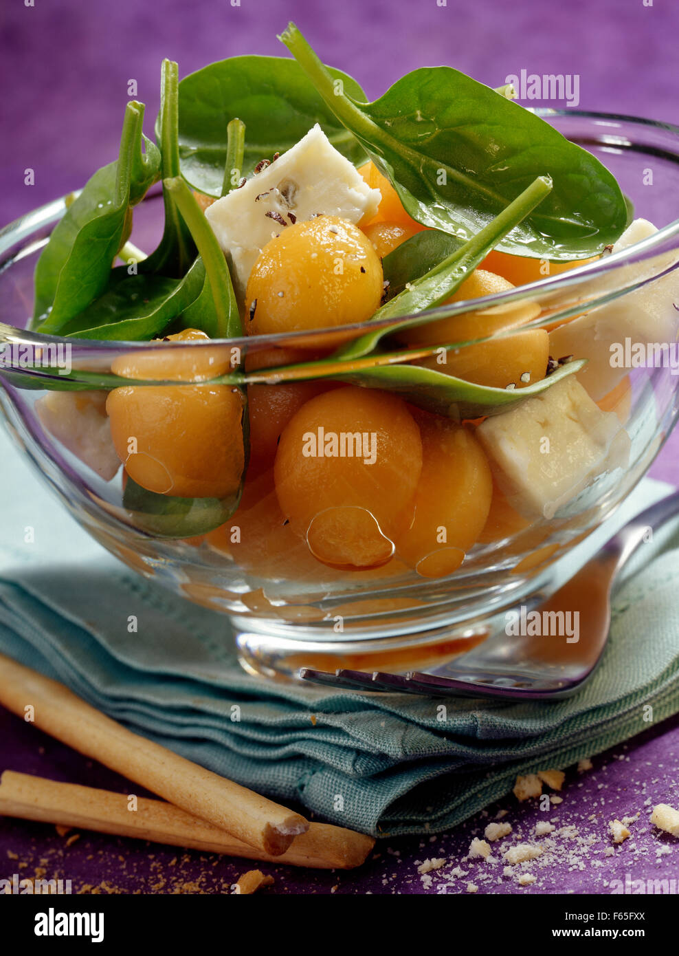 melon salad with gorgonzola and spinach shoots (topic: summer salads) Stock Photo