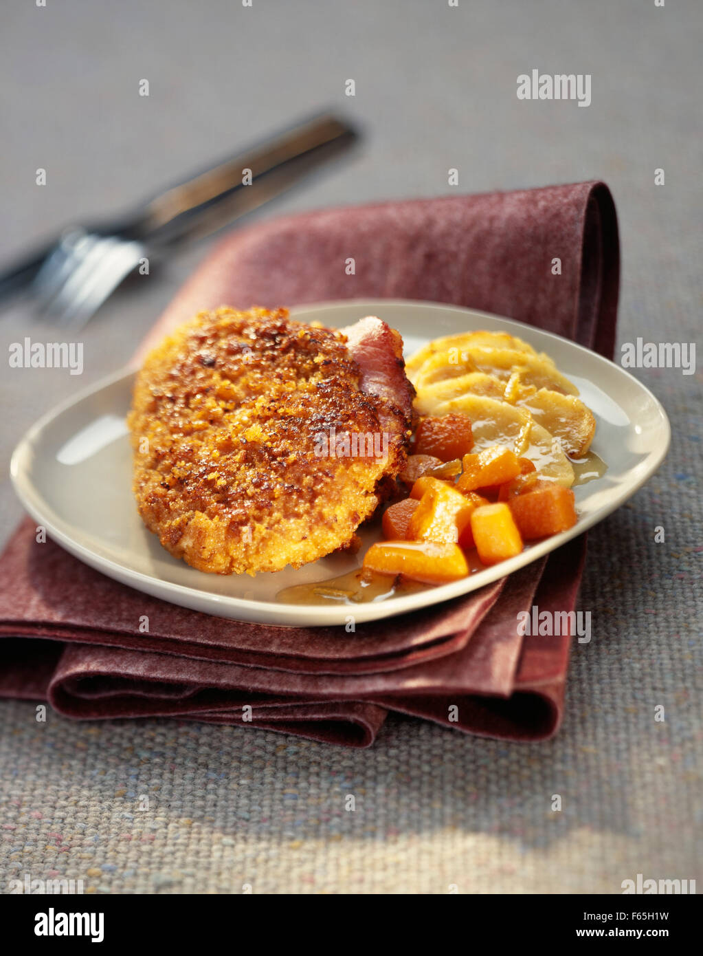 Chicken escalope with parmesan and Ginger bread crust Stock Photo