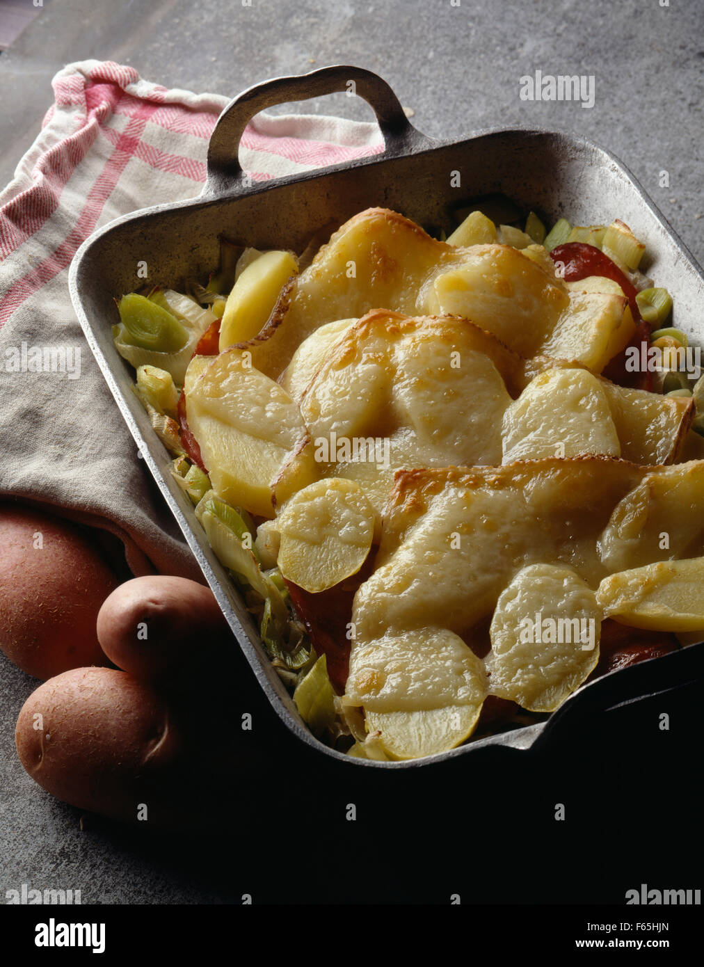 Potato and Manchego cheesetopped dish Stock Photo Alamy