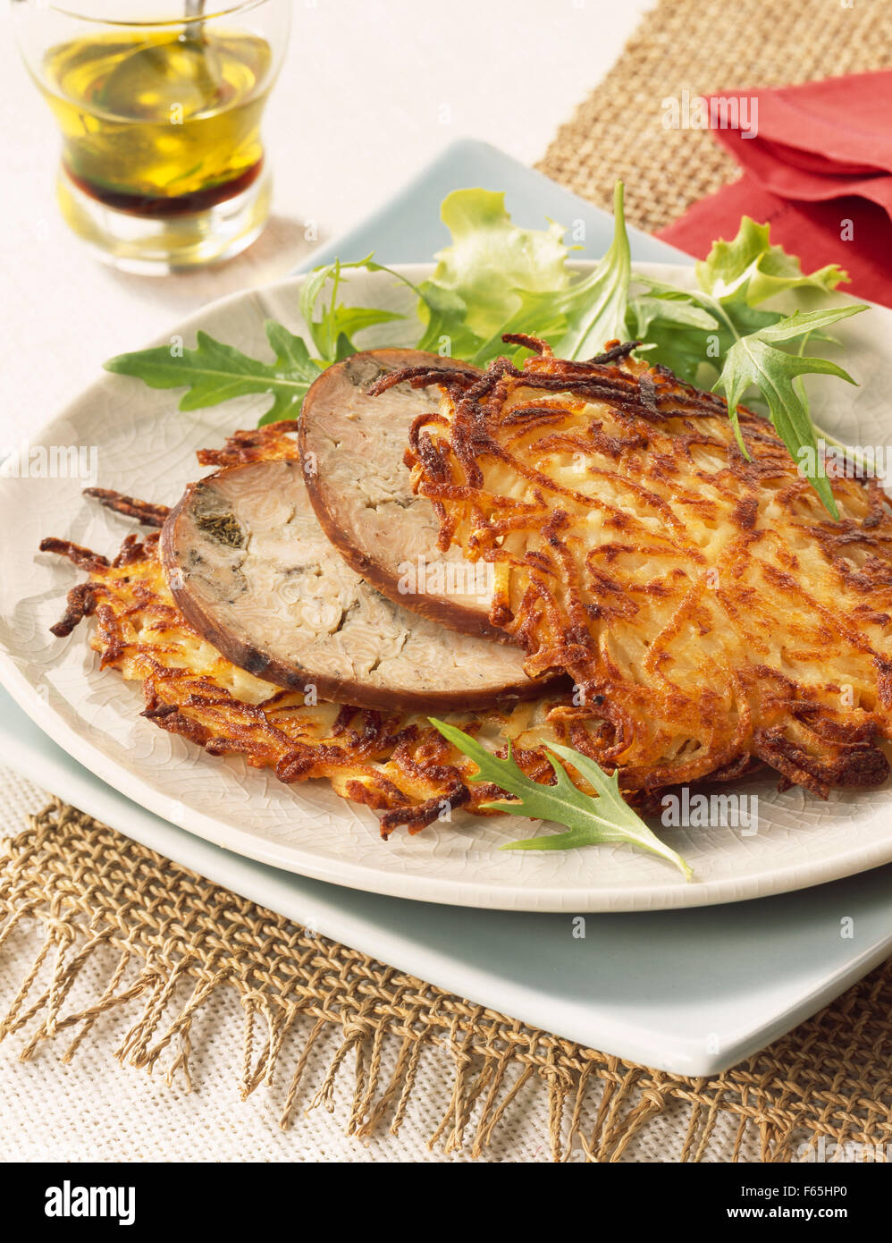 thin potato cakes with chitterlings sausage Stock Photo