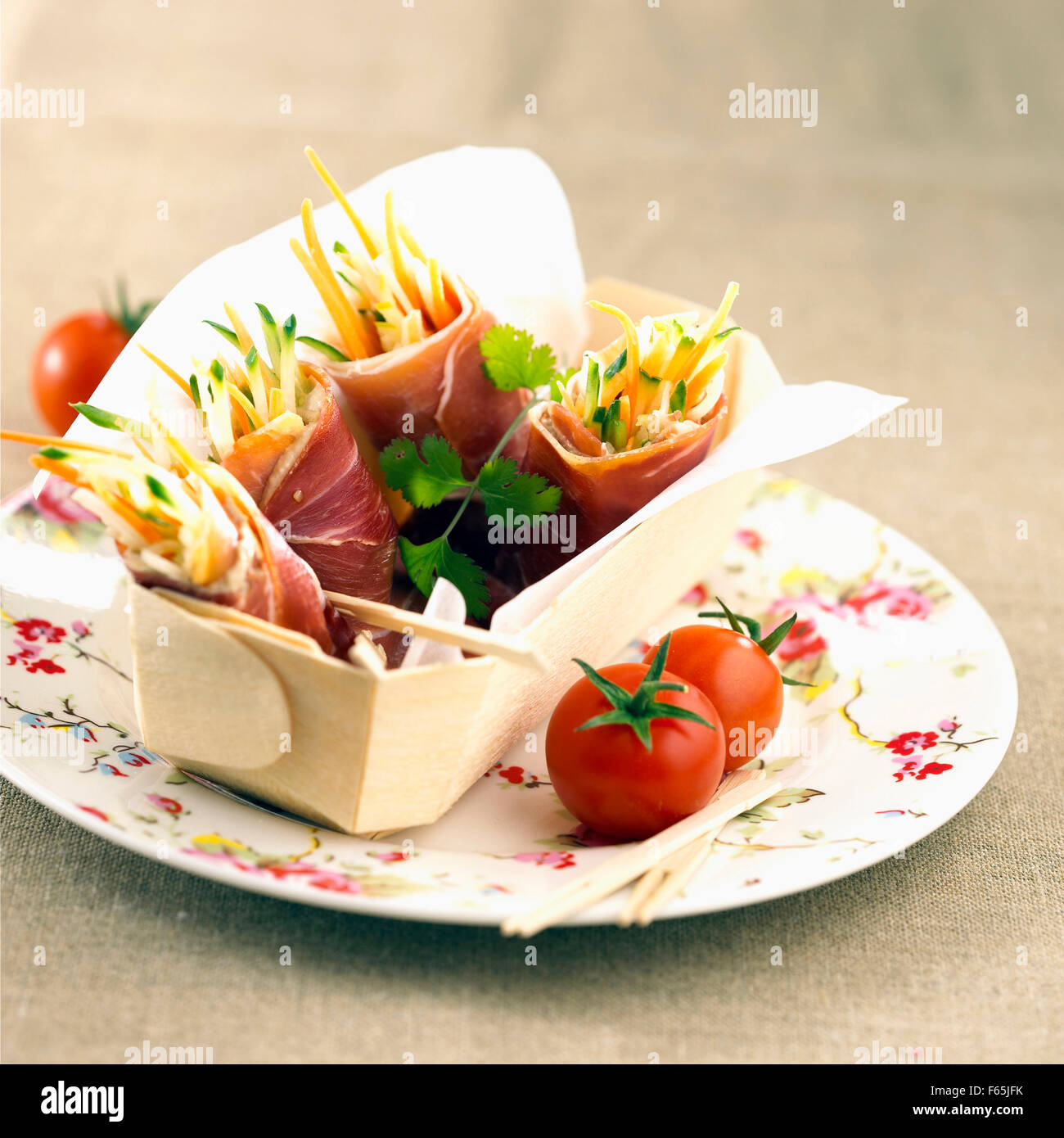 raw ham and vegetable wraps Stock Photo