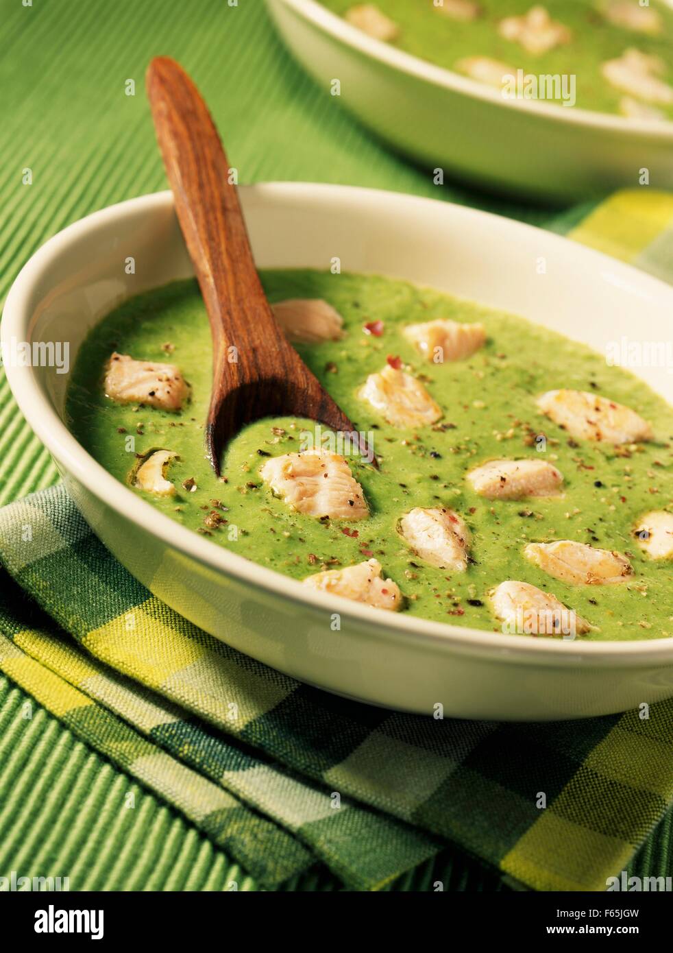 Cream of peas with diced salmon Stock Photo - Alamy