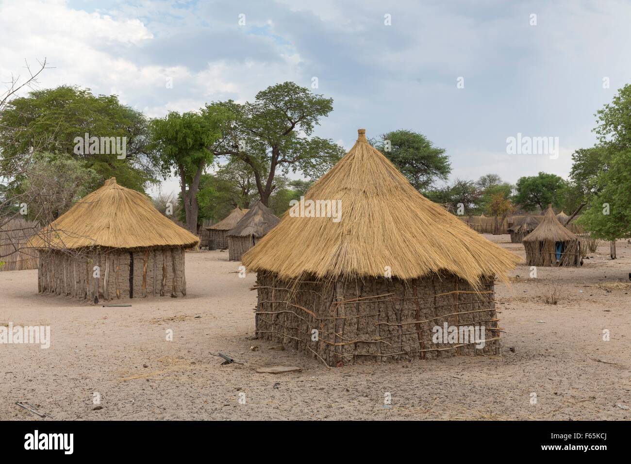 Traditionally built straw huts and farmsteads in the village of Morero near the Kwando River Stock Photo