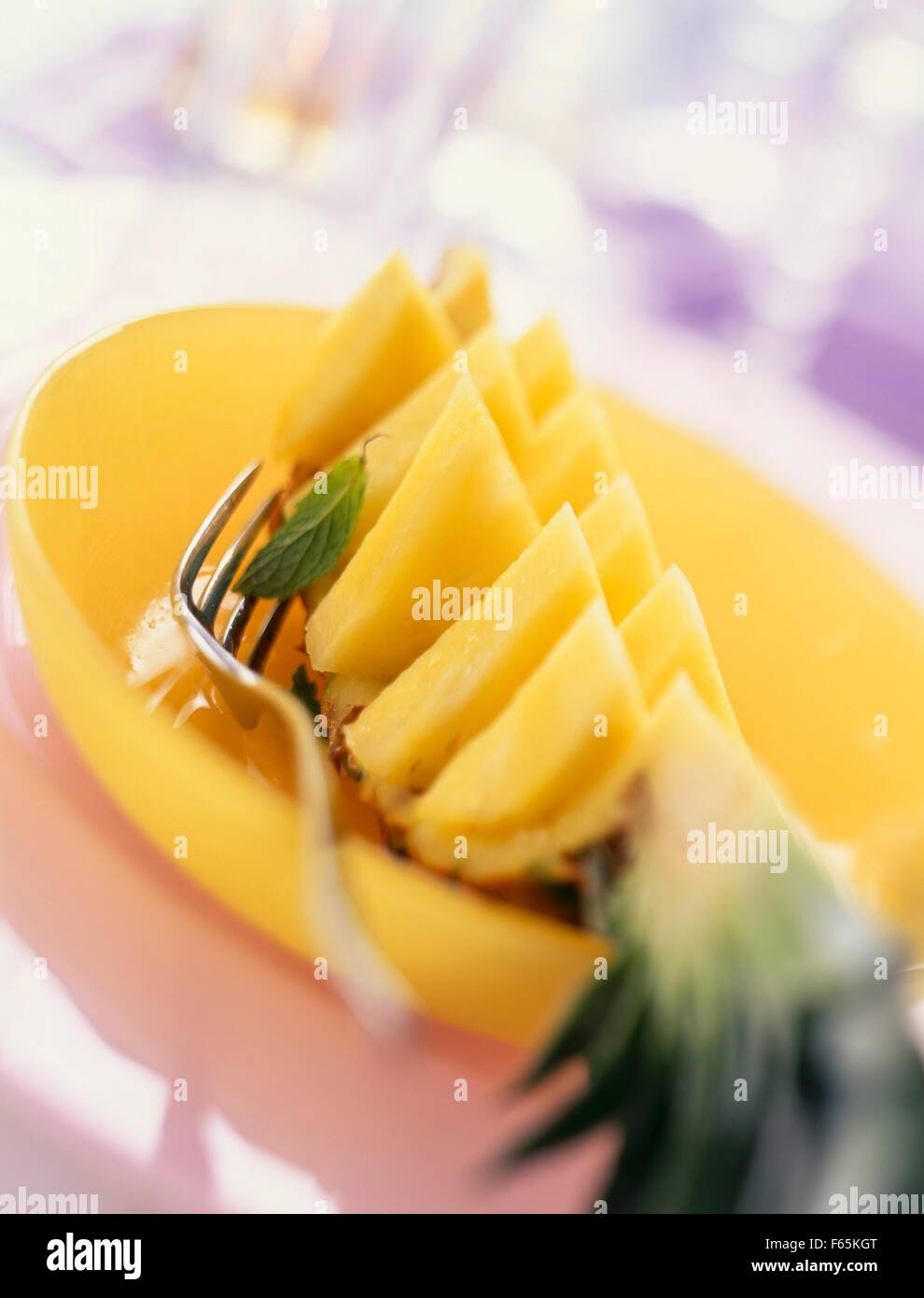 quarter of a pineapple cut in slices Stock Photo