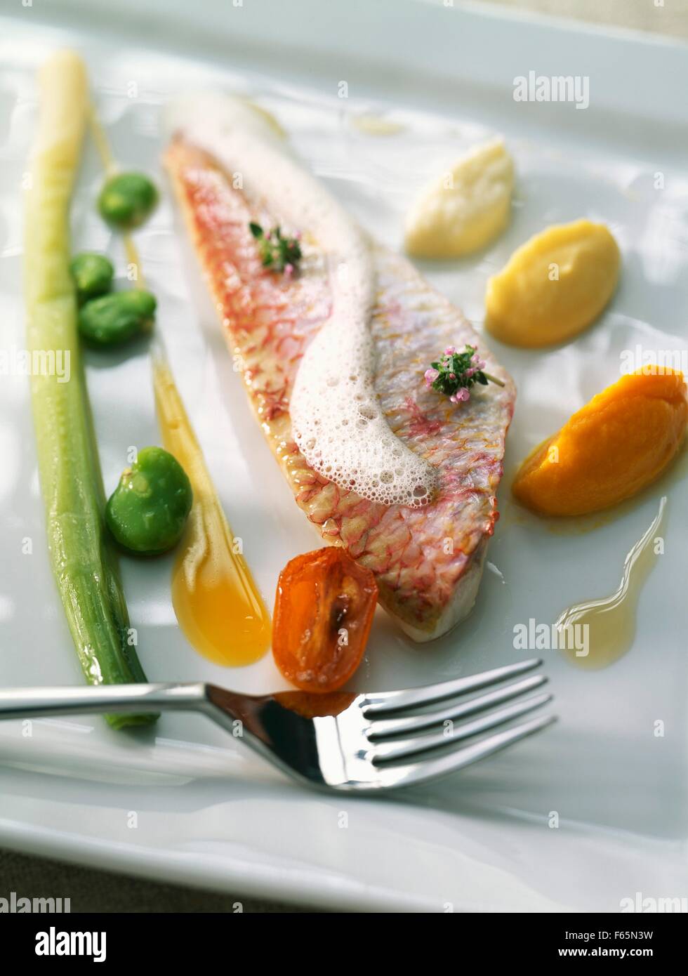 Red mullet fillet with carrot and orange mousse Stock Photo