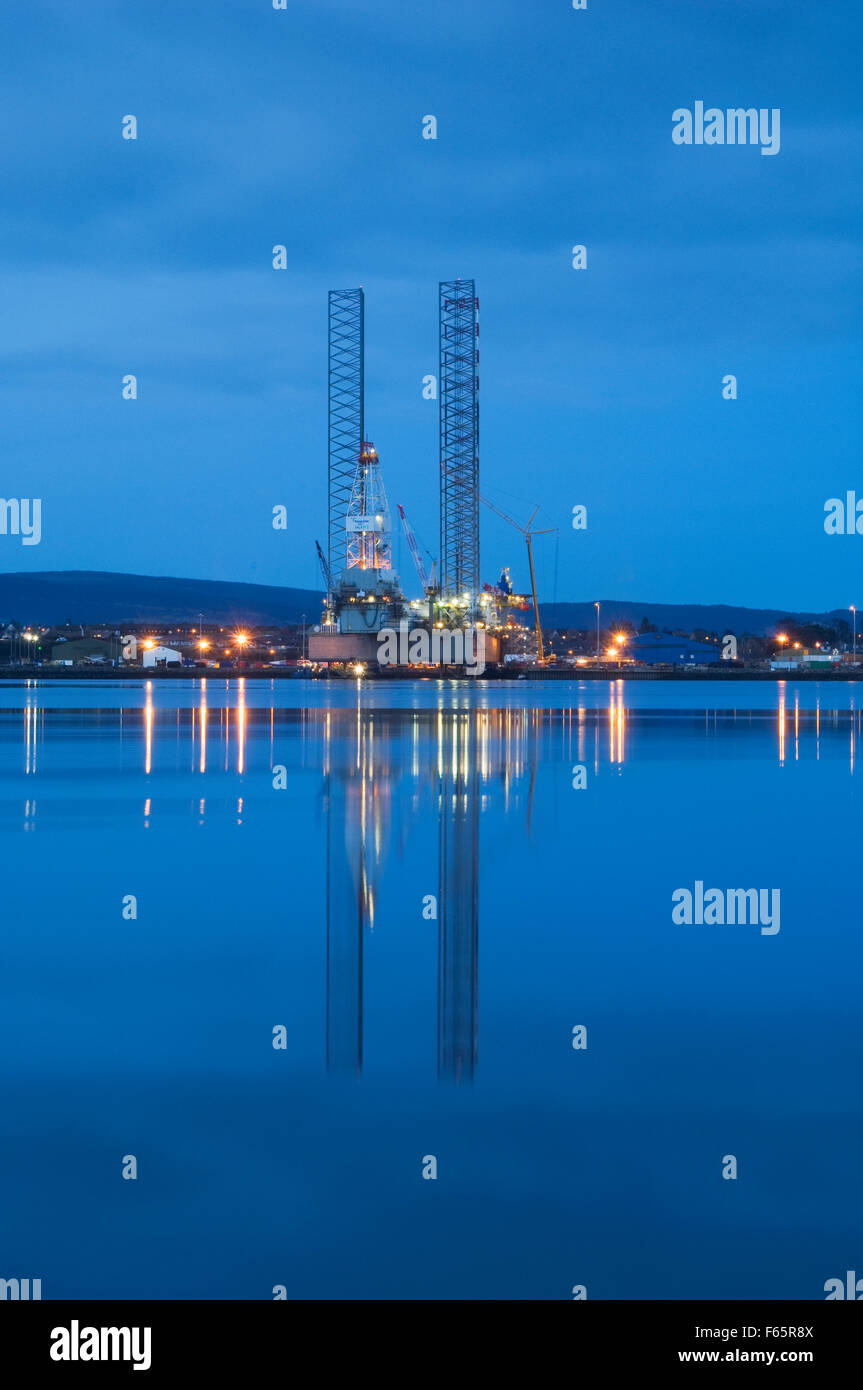 Oil rig moored in the Cromarty Firth at dusk, Ross-shire, Scotland, UK. Stock Photo