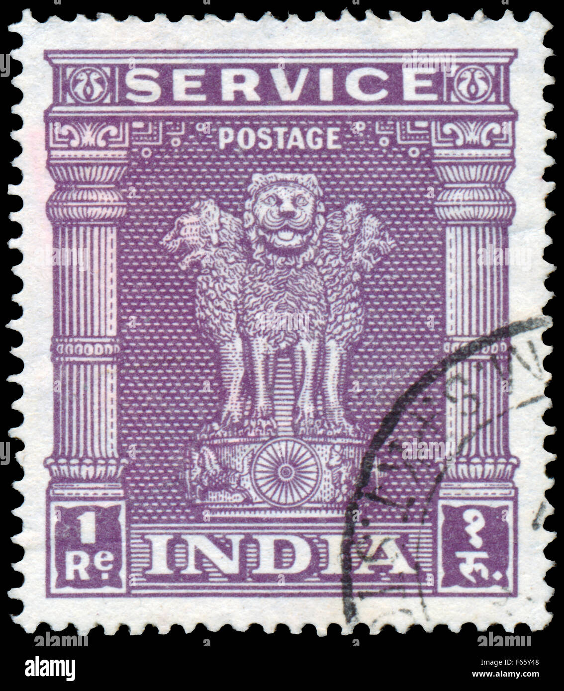 INDIA - CIRCA 1950: Stamp printed in India shows four Indian lions capital of Ashoka Pillar, circa 1950. Stock Photo