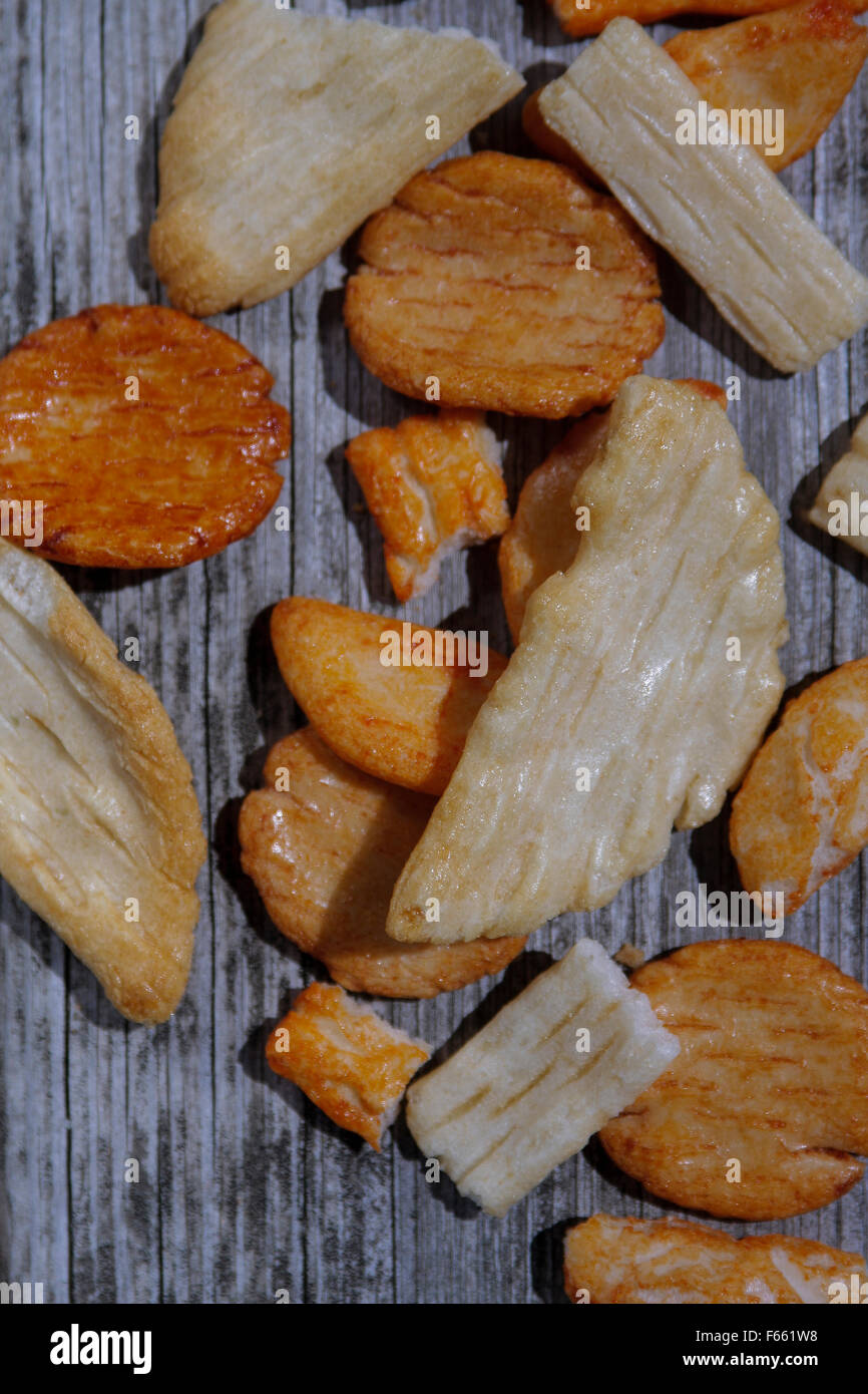 Crackers arranged in ramdp, design on raw, aged wood. Stock Photo