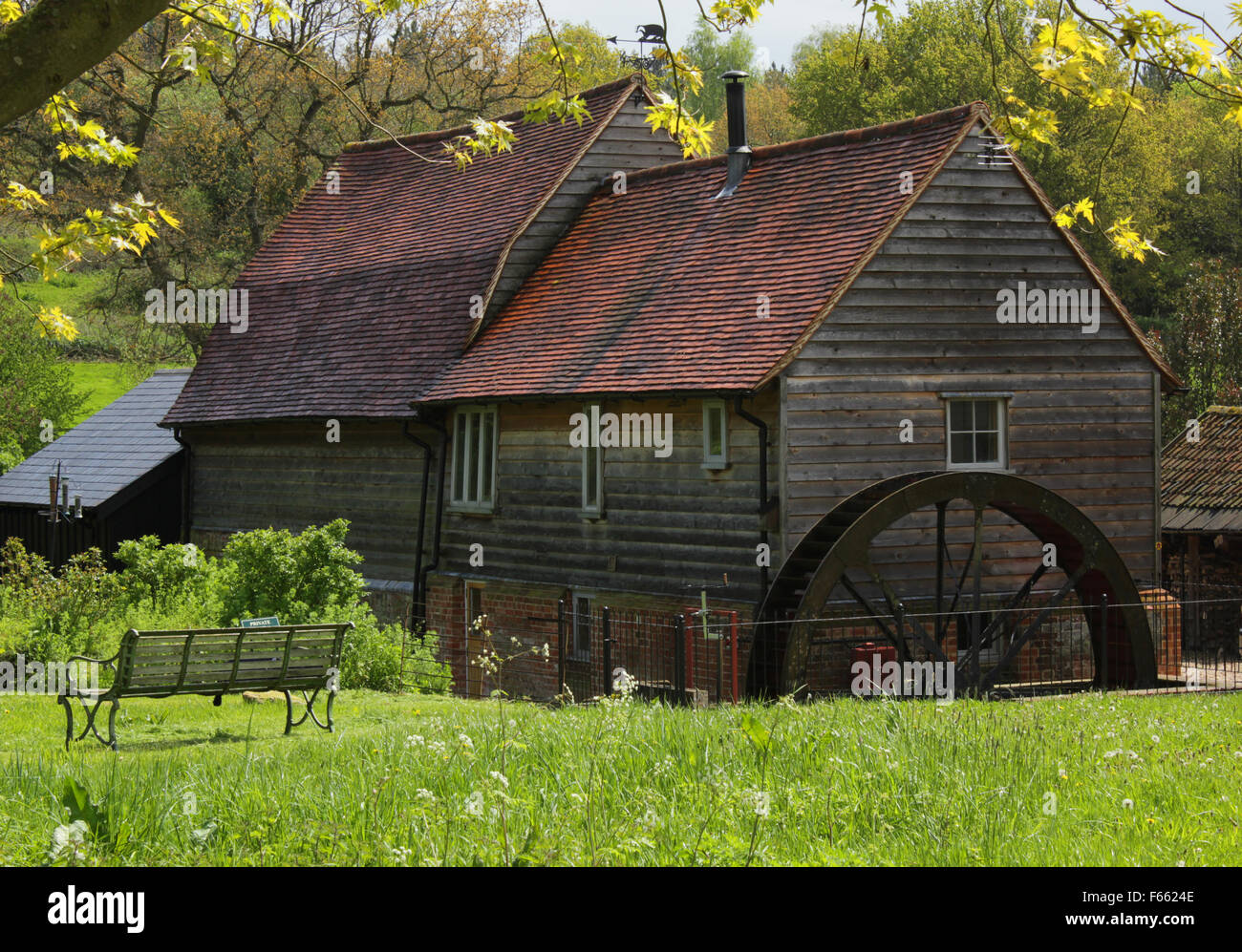 Mill Cottage with water wheel, Assington, Suffolk, United Kingdom Stock Photo