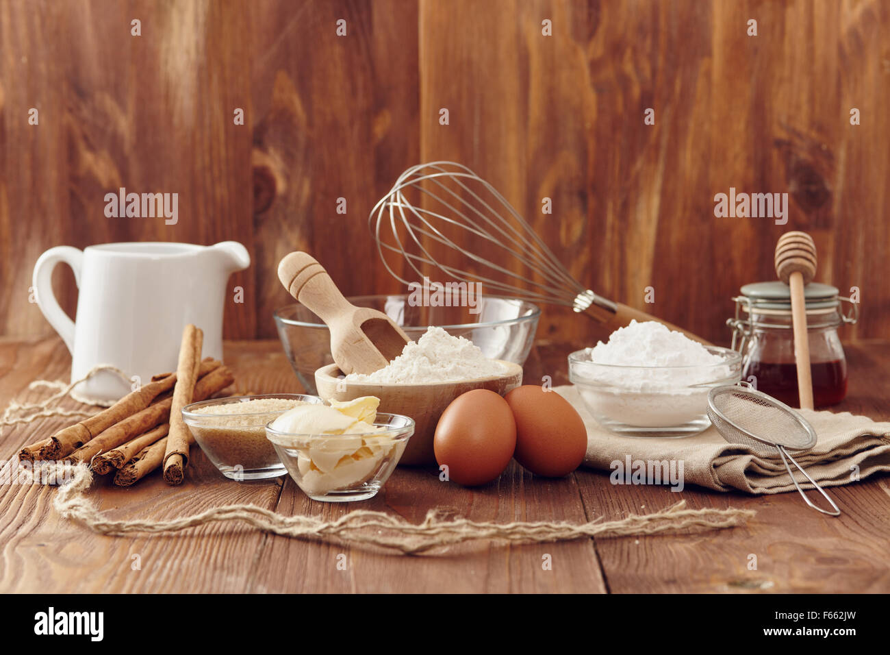 Ingredients to make a cake or a dessert on an aged wooden table Stock Photo