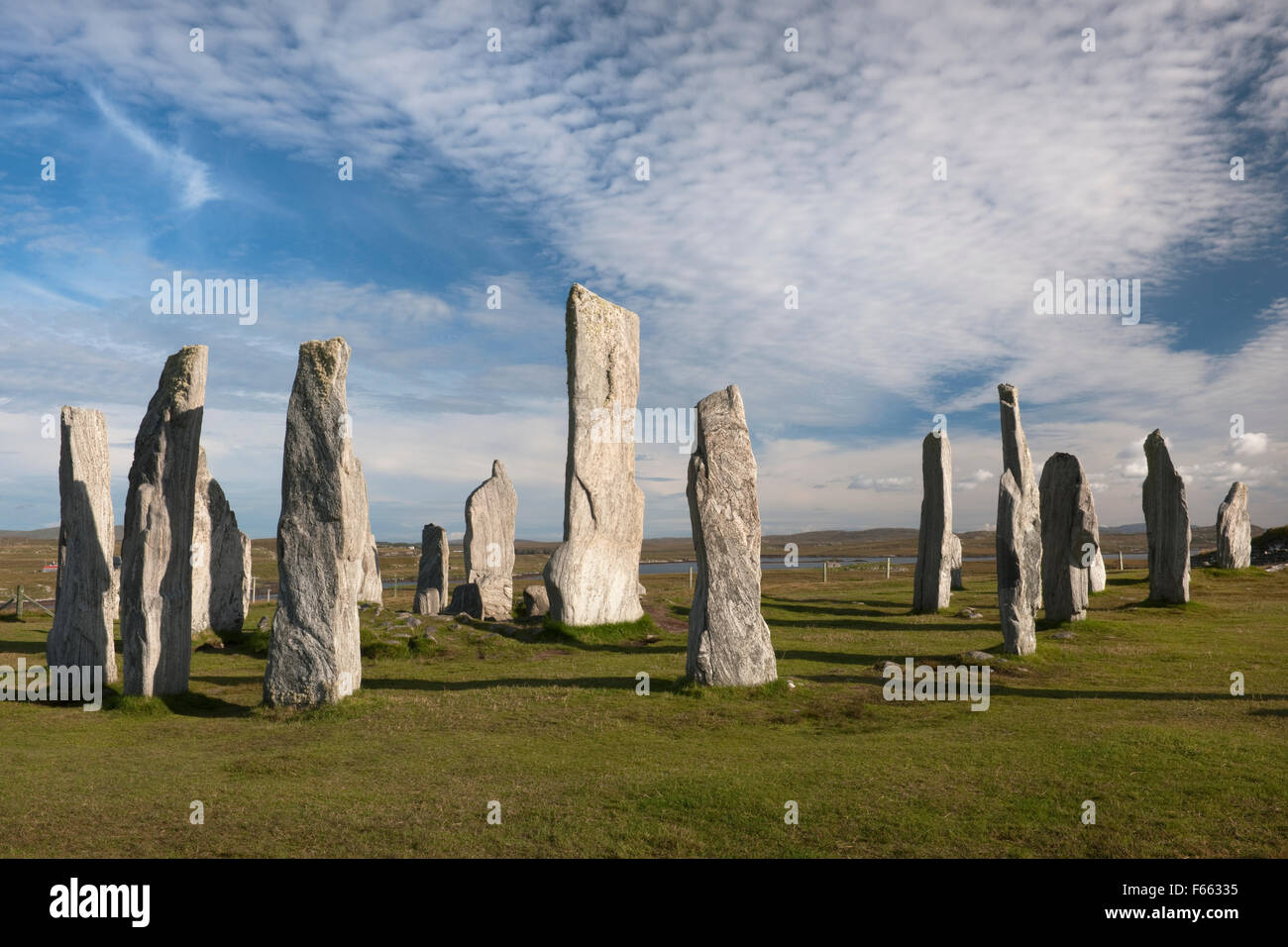 Looking ESE at Callanish (Calanais) Standing Stones, Isle of Lewis: central ring with chambered cairn & tall monolith plus stones of S row (R). Stock Photo
