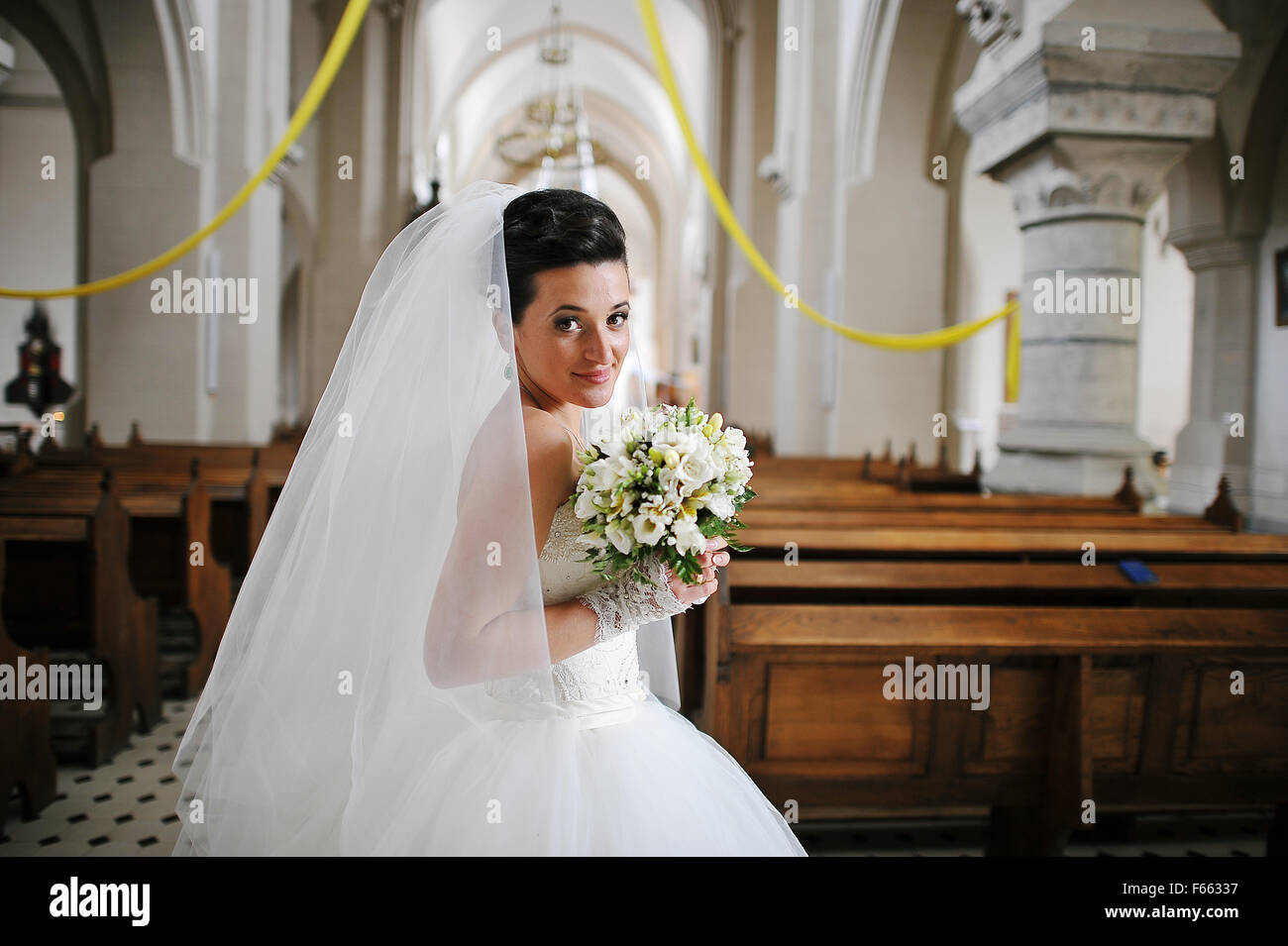 bride at the old catholic church Stock Photo - Alamy