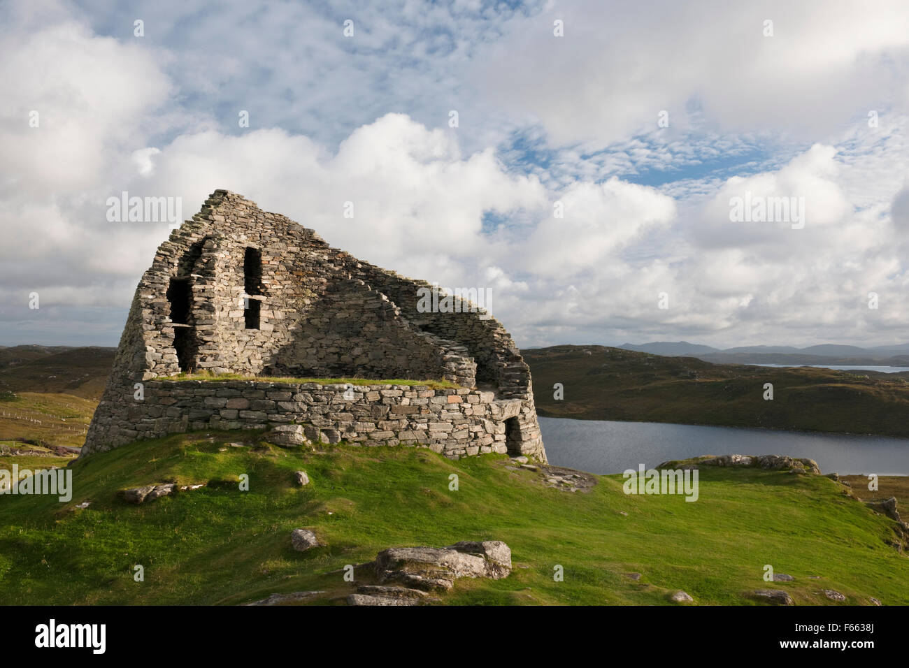 Looking SSE at Dun Carloway broch tower, Isle of Lewis, showing entrance on R (N) and the inner and outer drystone walls containing a staircase. Stock Photo