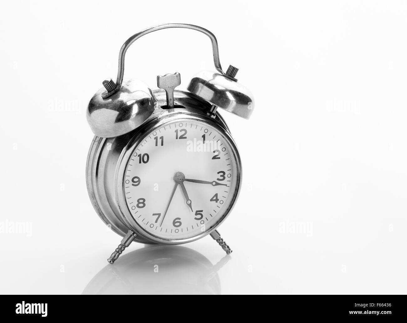 Classical alarm clock with reflection Stock Photo Alamy
