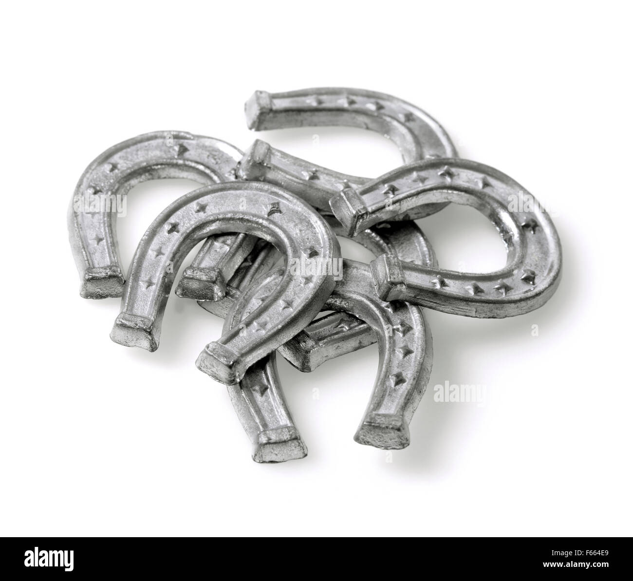 Small horse shoes made of tin, used in Finnish new years ritual where molten tin is used to foresee the coming new year Stock Photo