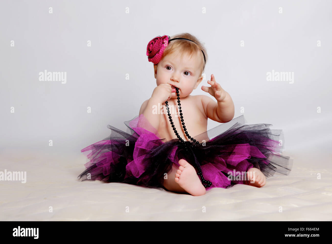 Little girl in purple skirt Stock Photo - Alamy