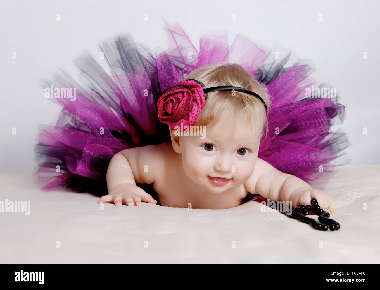Little girl in purple dress Stock Photo - Alamy